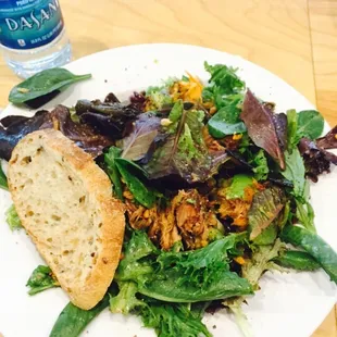 a plate of salad and bread