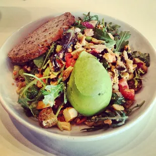 chicken,tomatoe, onion,carrots, croutons,craisins, avacado, sweet potatoe, edamame, parmasean/asiago cheese, old bay dressing!