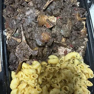 Oxtails, rice and peas, mac and cheese.