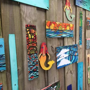 Colorful art behind the picnic tables