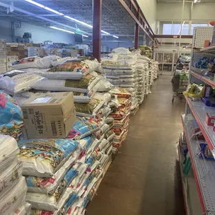 Bulk storage in between produce and shelves at entrance