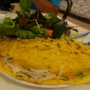 an omelet and salad on a plate