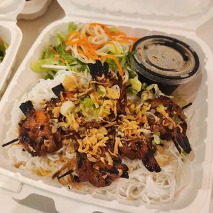 two take out containers of food