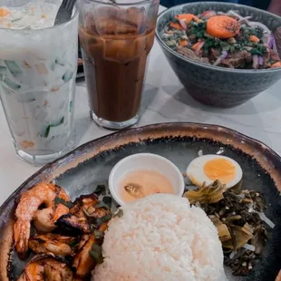 a plate of food with rice and shrimp