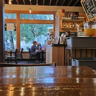 a man sitting at a table in a restaurant