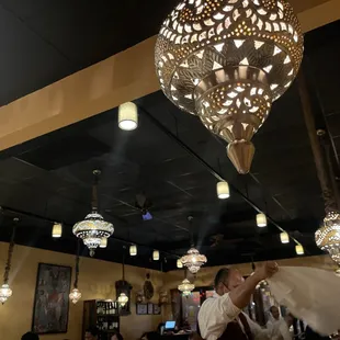 a bride and groom dancing in a restaurant