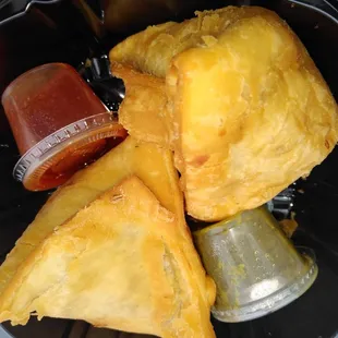 a variety of pastries in a plastic container