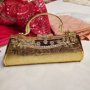 a gold purse on a table