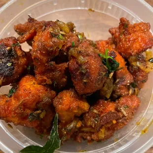 Chicken 65, low level spice. Still makes me cry lol and I love spice!