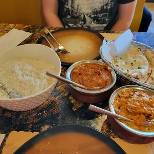 Rice, chicken curry, baigan curry, and garlic naan