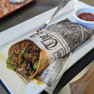 Lamb kathi wrap. Delish. Hot, warm, spicy, sliced. Very oily though. Loved the sweet/tart sauce