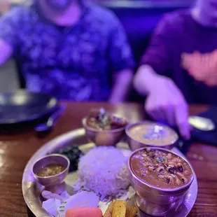 Chicken Chicken Nepali Thali Set  Included lentils, curry chicken, rice, black-eyed peas, pickled radish &amp; perfectly seasoned spinach.