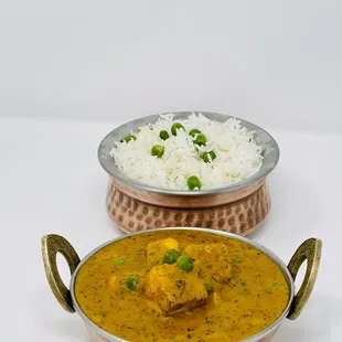 two bowls of curry and rice