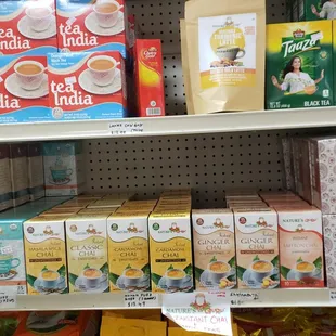 a shelf of tea and tea bags