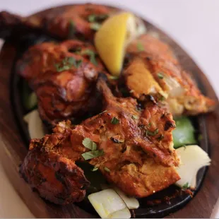 Tandoori Chicken sizzling hot out of tandoor