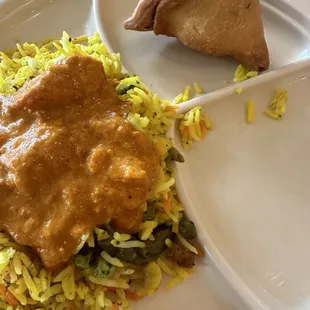 Rice with veggies, butter chicken and a veggie samosa.