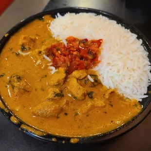 Chicken Tikka Masala with basmati rice &amp; topped with spicy sauce (upon request)