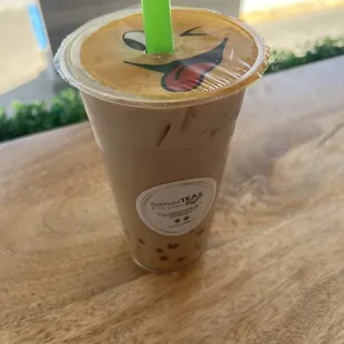 Coconut milk tea with lychee jelly and passion fruit popping boba