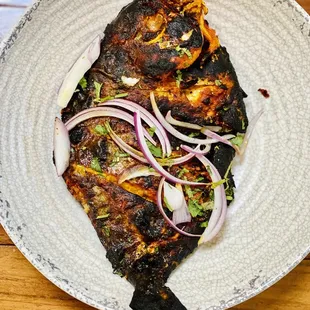 Whole tandoori fish. Fish is sweet.