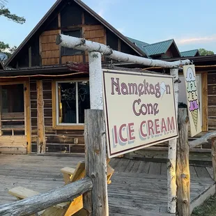 a sign in front of a building