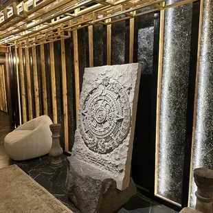 a stone sculpture in a lobby