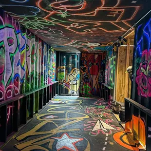 a graffiti covered hallway