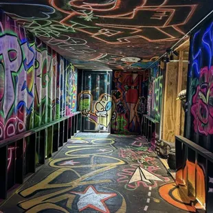 a graffiti covered hallway