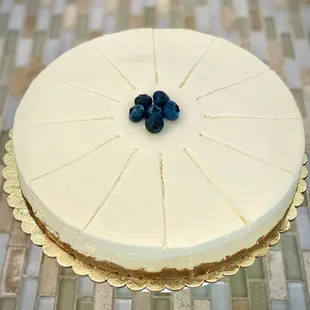 9 inch Classic Cheesecake with Blueberry garnish. Simple an delishious.
