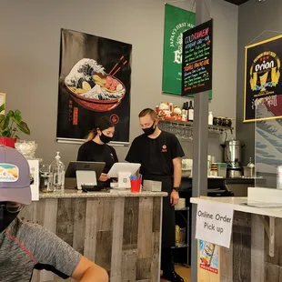 a man sitting at a table in a restaurant