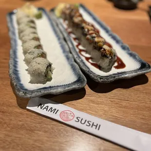 two plates of sushi on a table