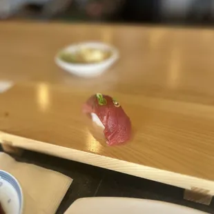 a sushi on a wooden plate