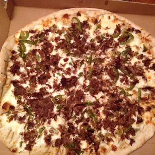 Cheese steak pizza with no mushrooms. Really piled on the meat