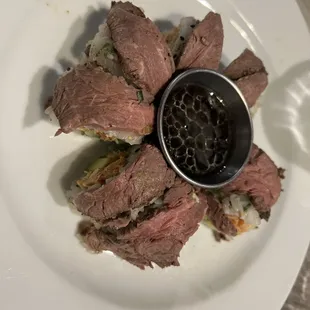 a plate of food with meat and sauce