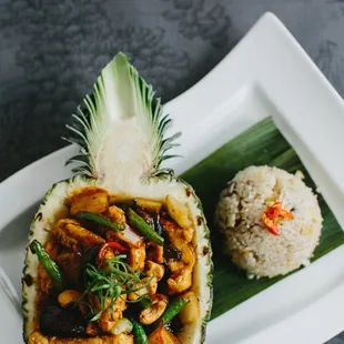 Sautéed crispy chicken breast with sweet red chili paste, fresh pineapples, onions, scallions, cashew nuts and mushrooms