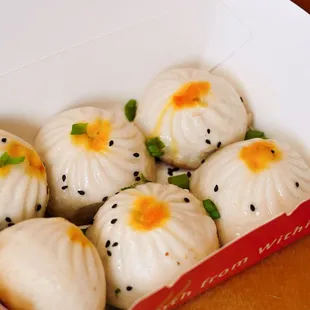 a box of chinese steamed dumplings