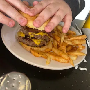 Double cheeseburger with bacon and fries