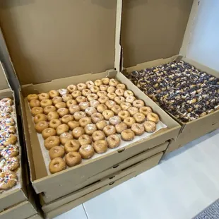 three boxes of mini doughnuts