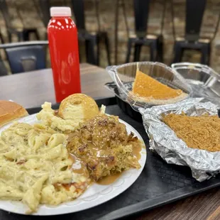 Chicken Alfredo pasta, Stuffing, Mashed Potatoes, Sweet Potato Pie, kool aide