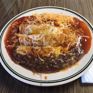 Shredded beef enchiladas with rice and beans