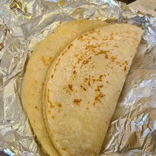 Handmade corn tortillas are perfectly cooked on the flat top.