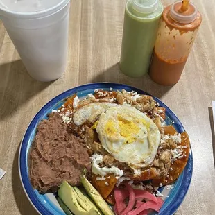 Red Chilaquiles I added chicken but it came with the egg, avocado and beans