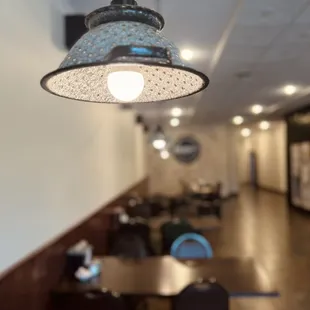 Unique custom lighting created with kitchen colanders