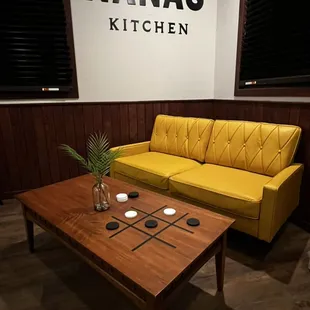 Play a game, read a book, enjoy some ice cream or coffee on our iconic yellow couch