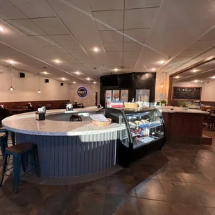 Interior photo - featuring a rounded countertop so patrons are able to easily converse with neighbors
