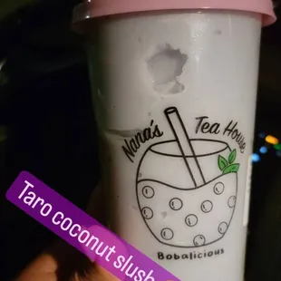 a hand holding a cup of tea