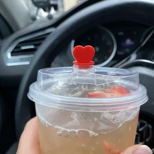 a hand holding a cup of tea