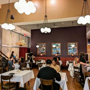 Inside. View of main dining room facing bar (on other side of wall) and front of house / entrance.