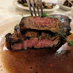 Charcoal-Grilled Ribeye Steak. 16 ounces. Market price was $60. Picture of cross section. I ordered it medium rare.