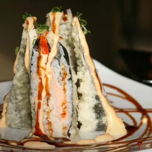 a stack of sushi on a plate