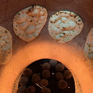 Fresh Naan in the making! Come get some Naan before it's gone!!